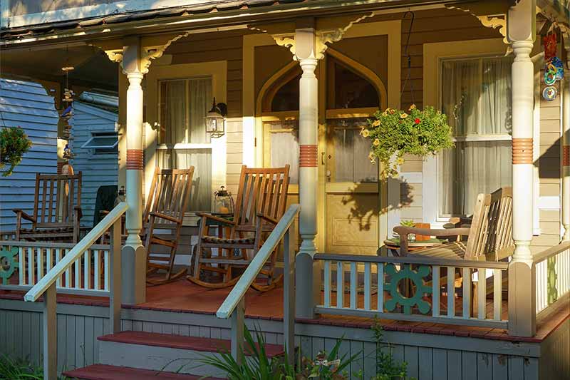 A front porch of a Gingerbread Cottage in Oak Bluffs, MA