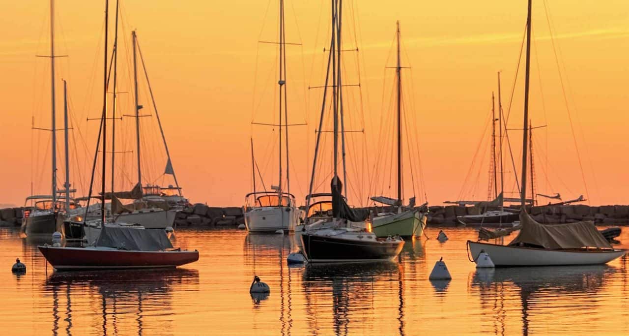 Sailboat silhouettes during a vibrant Marthas Vineyrd sunset